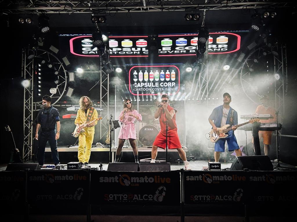 Capsule Corp Cartoon Band al The Cage